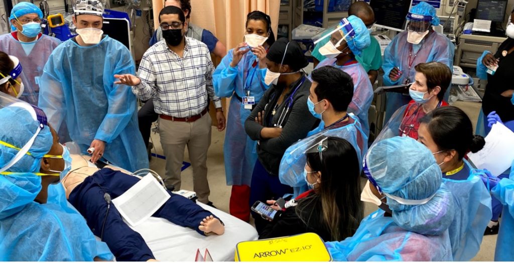 Students participating in a EM procedure simulation