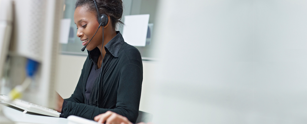 image of woman with headset scheduling an appointment