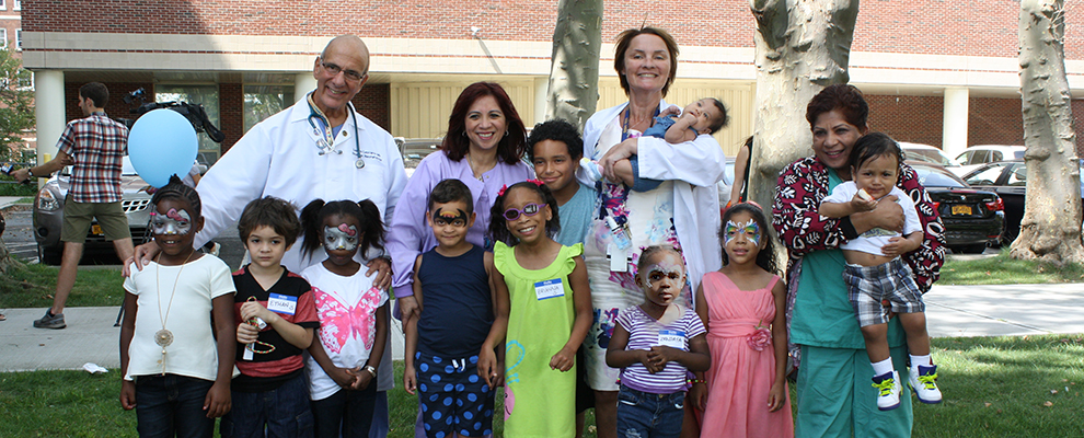 Image of SBH staff with children