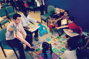 Image of Dr. reading to children