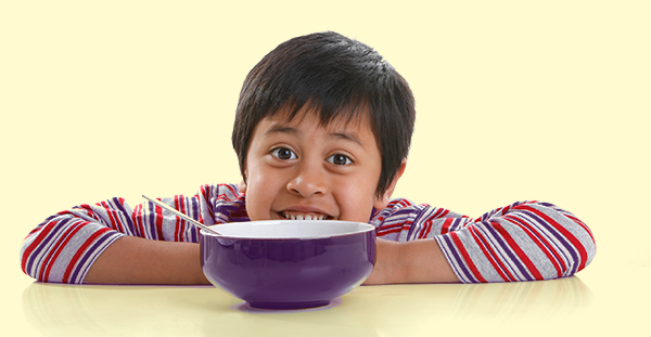 image of child eating breakfast