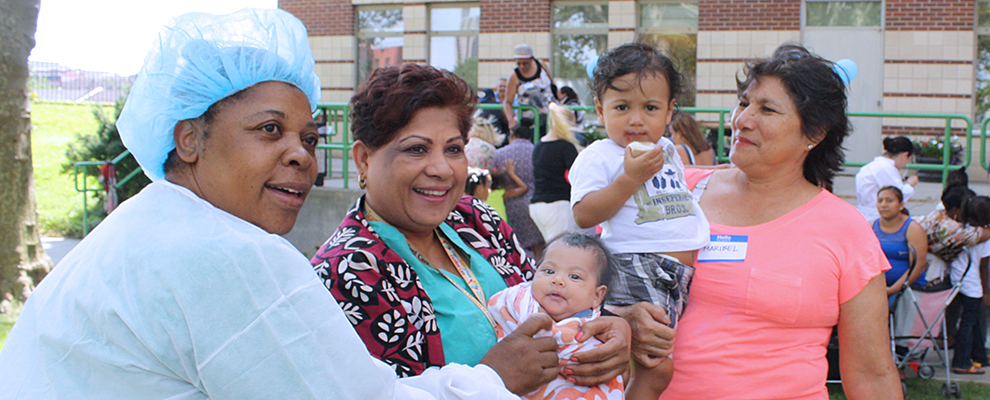 Image of SBH staff with grandmother and baby at SBH NICU Reunion