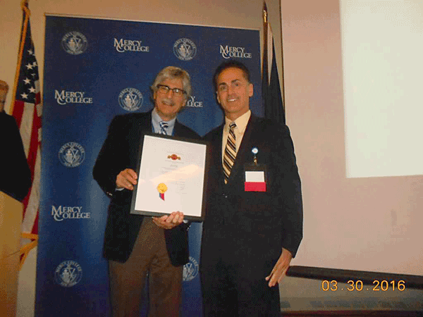 Image of Dr. James Croll, MD, accepting a recognition award