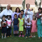 Image of Dr. Lezcano and his staff with ten children from the SBH NICU