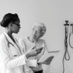 Image of female doctor consulting with patient