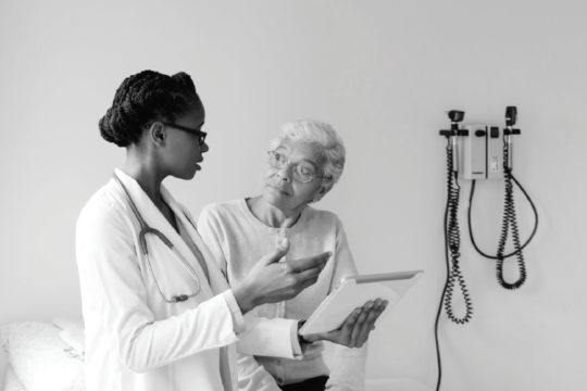 Image of female doctor consulting with patient