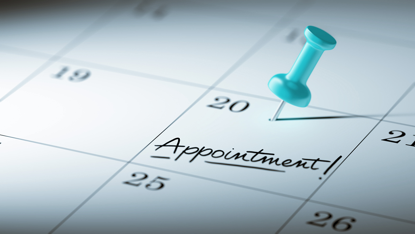 Concept image of a Calendar with a blue push pin. Closeup shot of a thumbtack attached. The words Appointment written on a white notebook to remind you an important appointment.