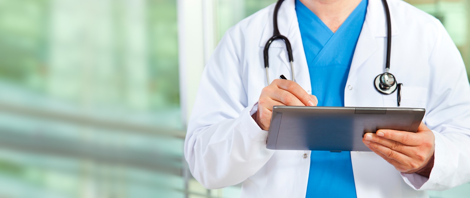 image of doctor holding tablet